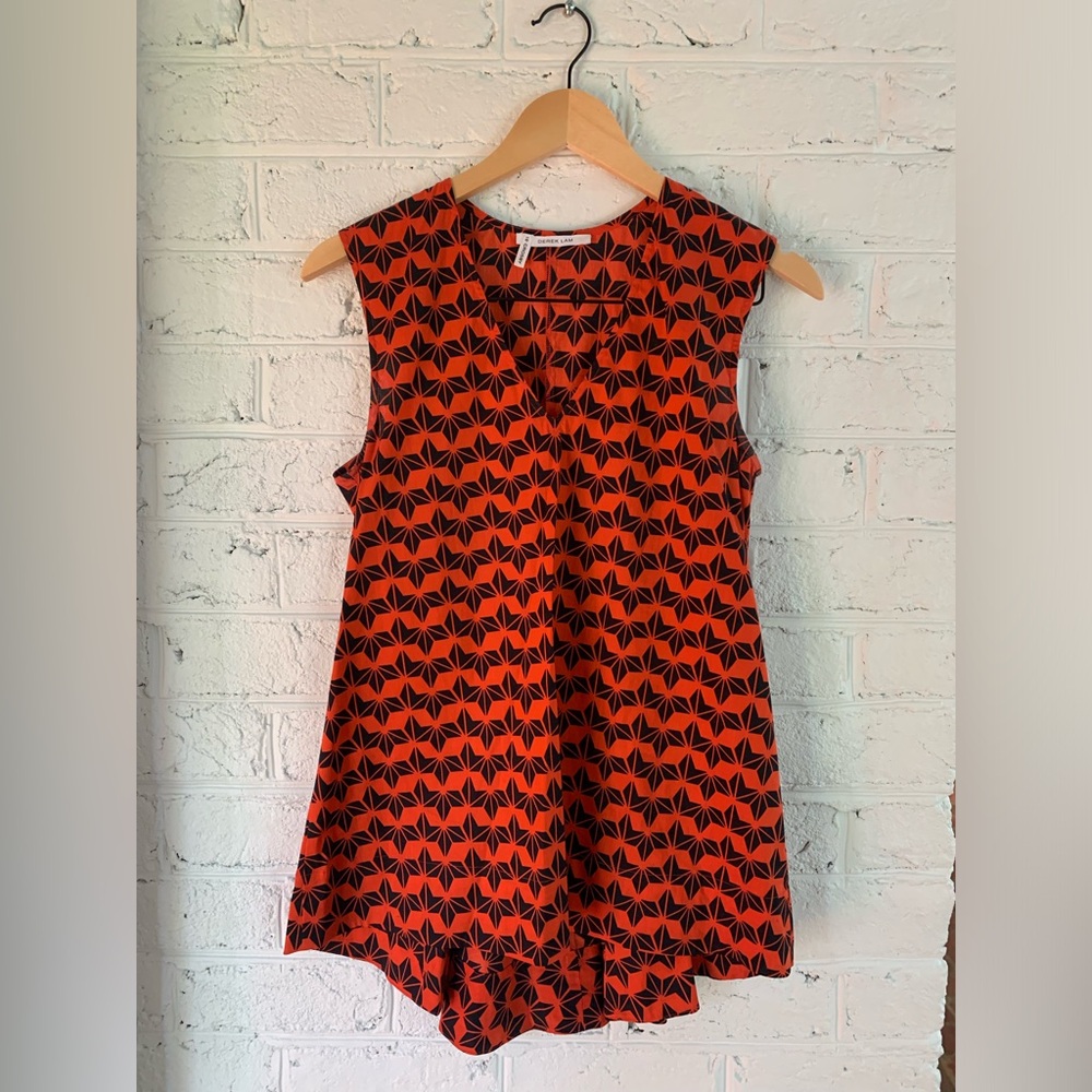 Derek Lam sleeveless tailored v neck top with back bustle detail.